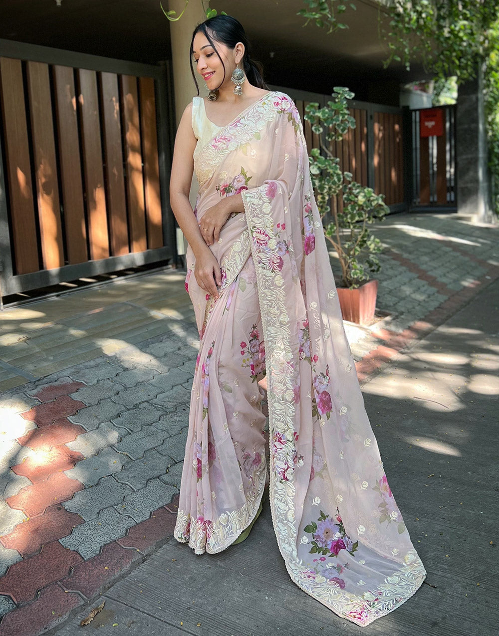 Light Peach Georgette Printed Saree With Embroidery Work & Lace Border