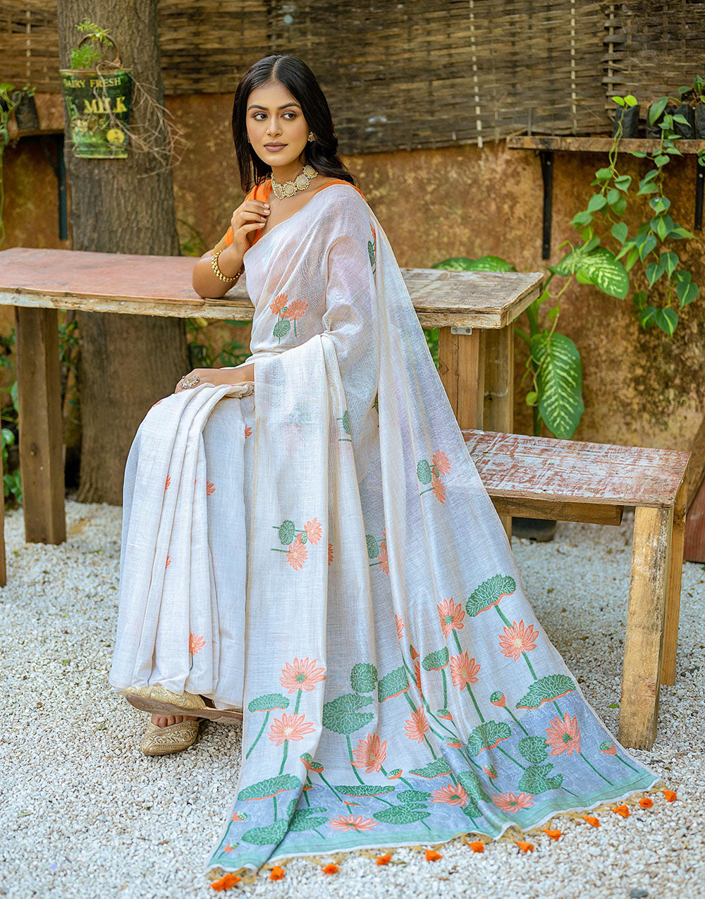 Orange Soft Muga Silk Saree With Floral Weaving Work