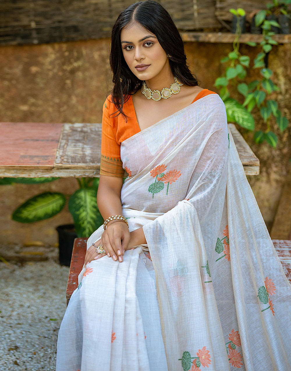 Orange Soft Muga Silk Saree With Floral Weaving Work