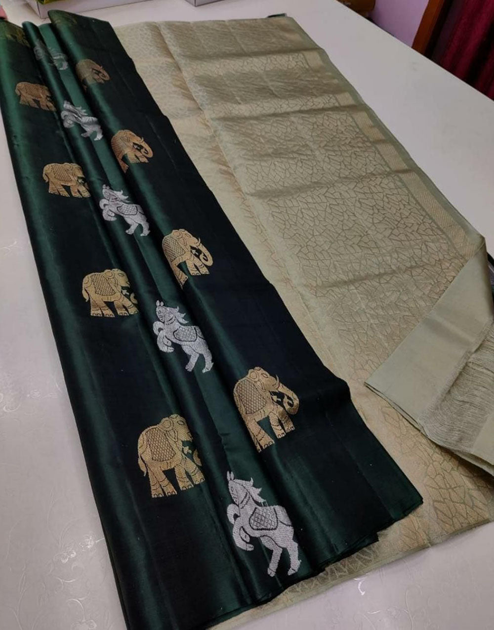 Dark Green Silk Saree With Zari Weaving Work