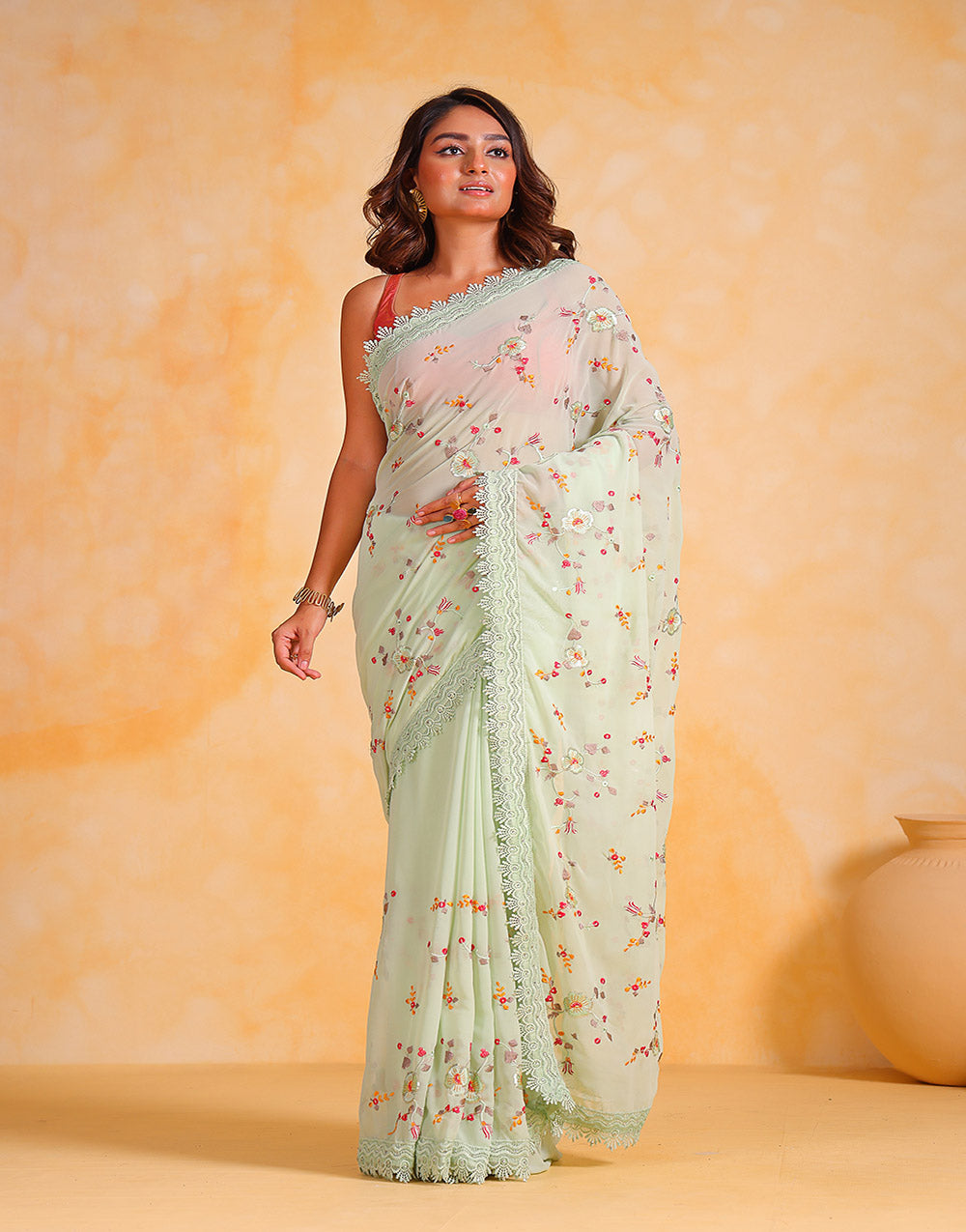 Tea Green Georgette Saree With Thread Embroidery Work & Cutwork Border