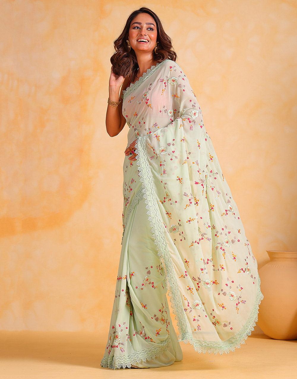 Tea Green Georgette Saree With Thread Embroidery Work & Cutwork Border