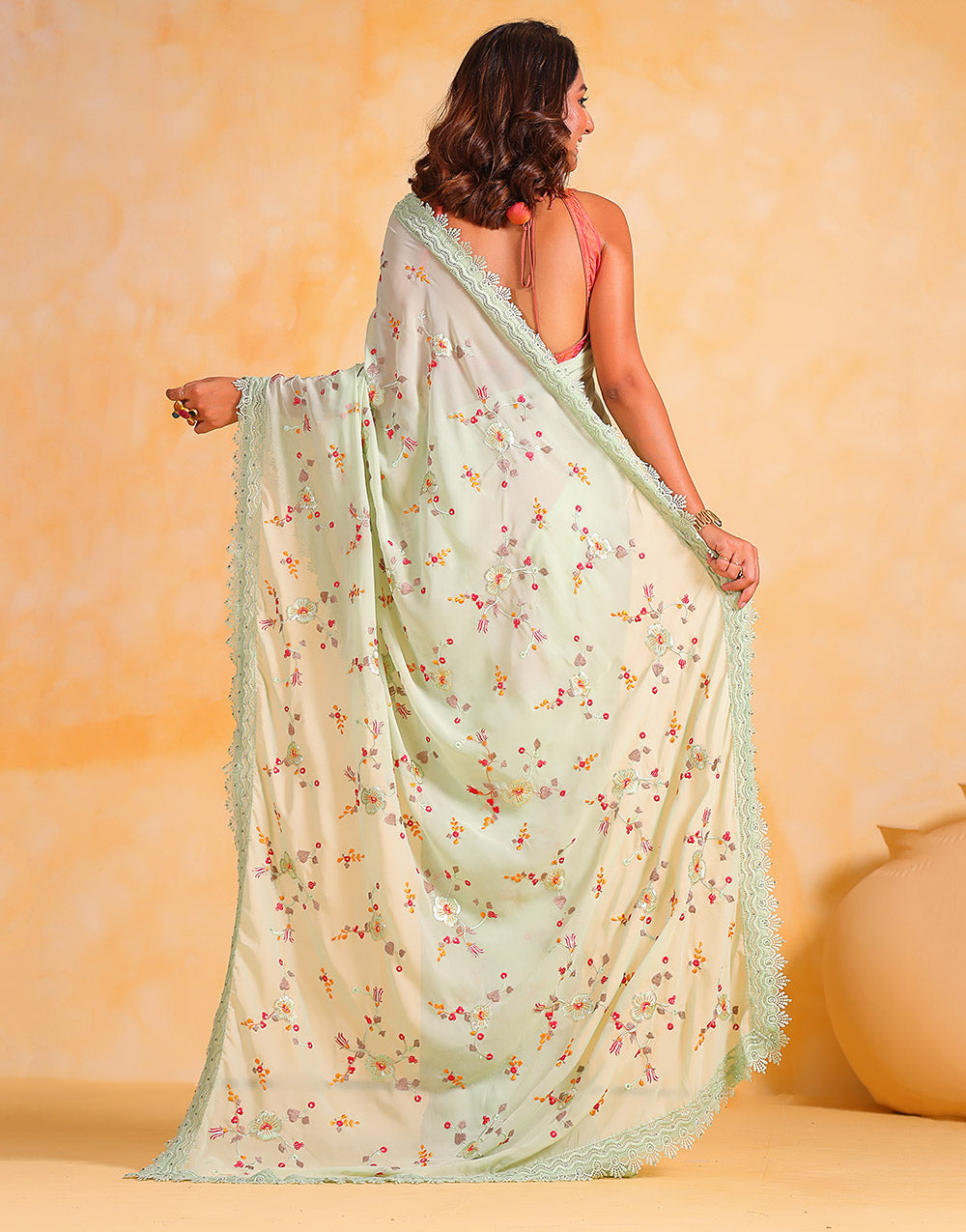 Tea Green Georgette Saree With Thread Embroidery Work & Cutwork Border