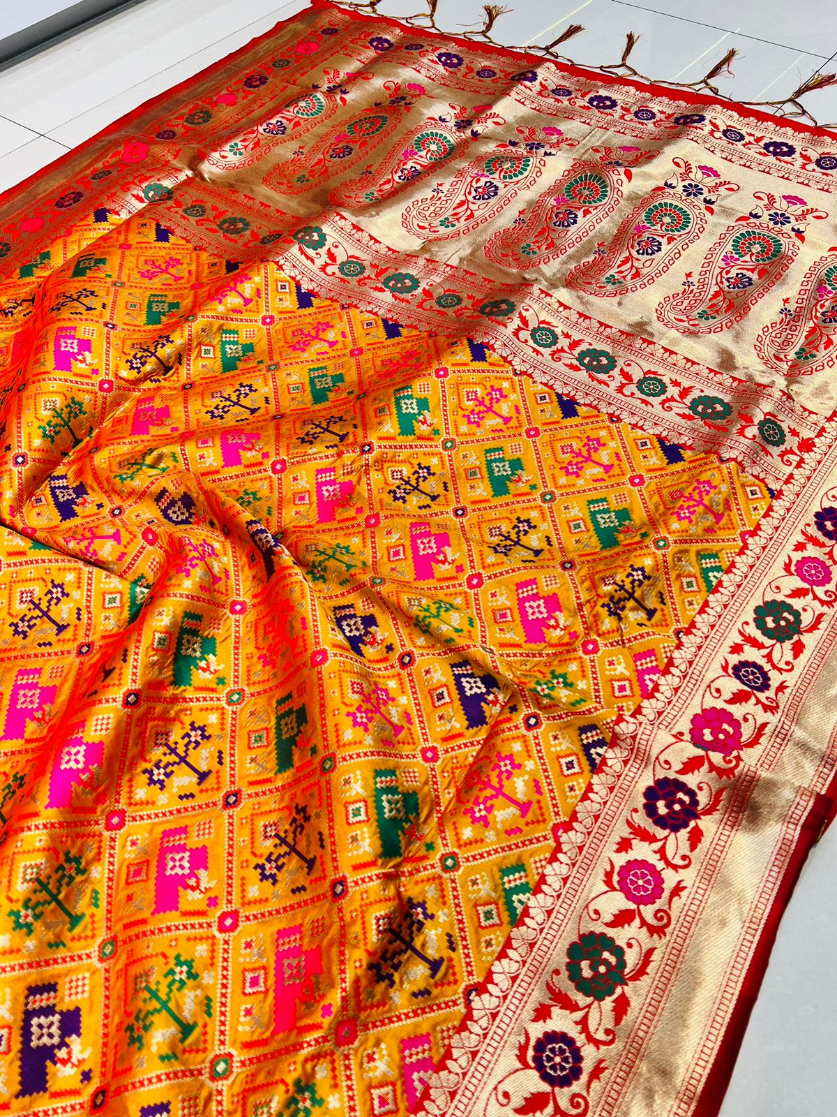 Orange Soft Patola Silk Saree With Zari Weaving Work