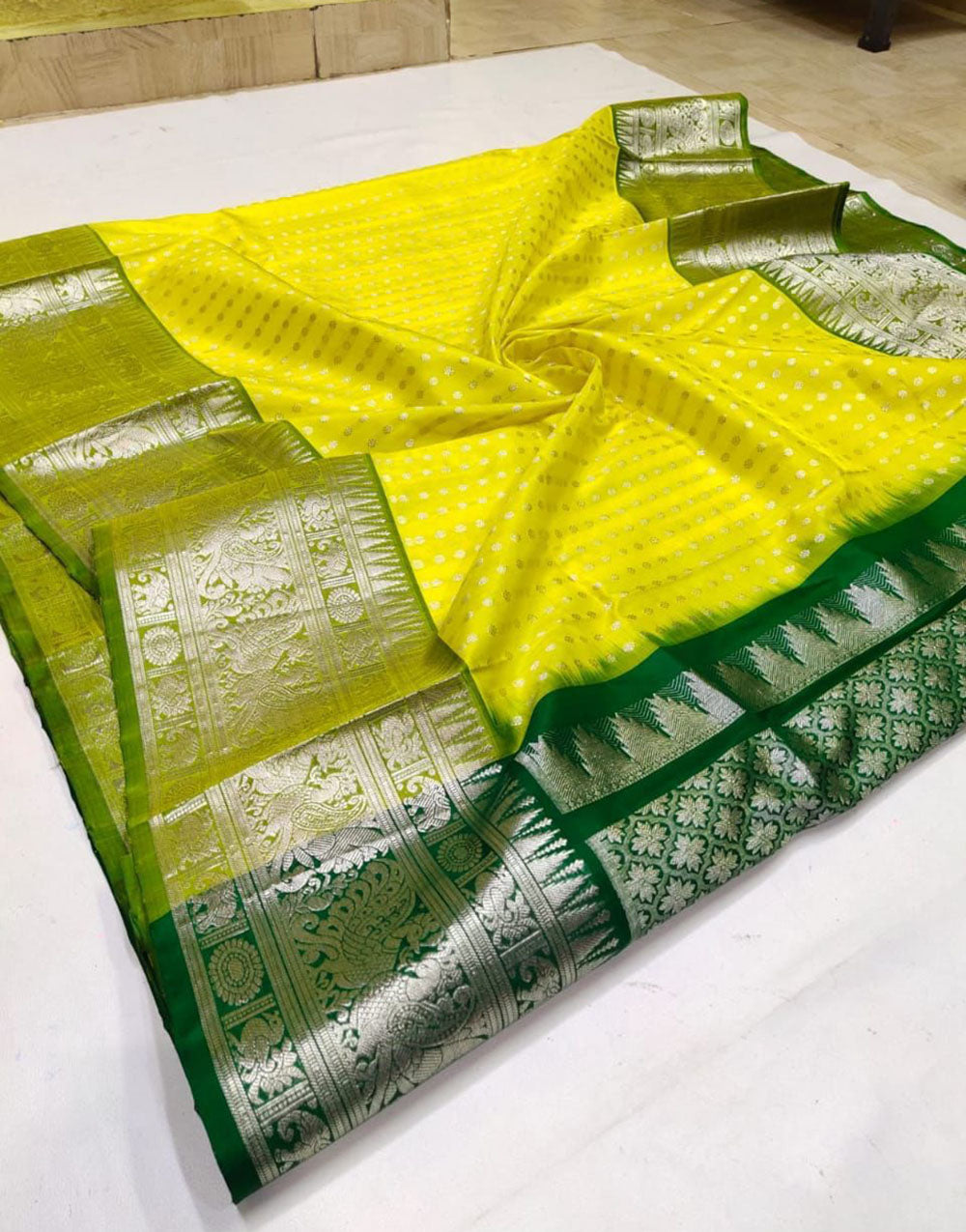 Yellow & Green Lichi Silk Saree With Zari Weaving Work