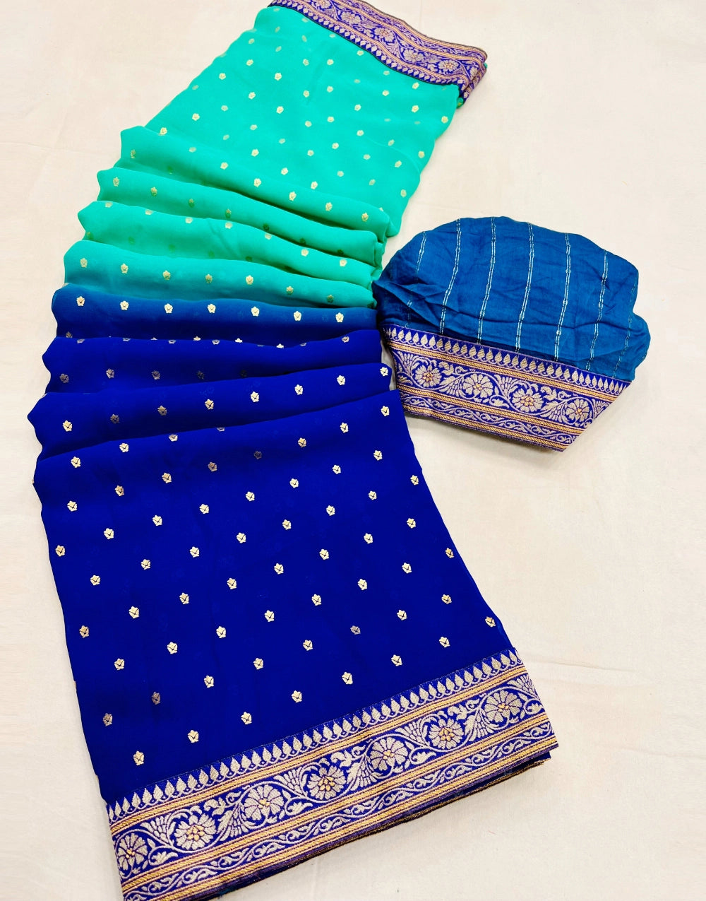 Sky Blue Color Heavy Georgette Foil Print Saree