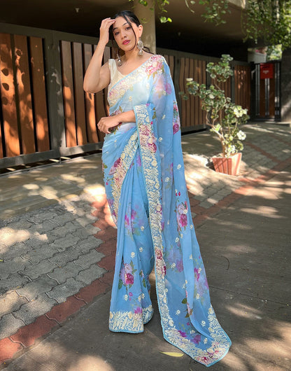 Maya Blue Georgette Printed Saree With Embroidery Work & Lace Border