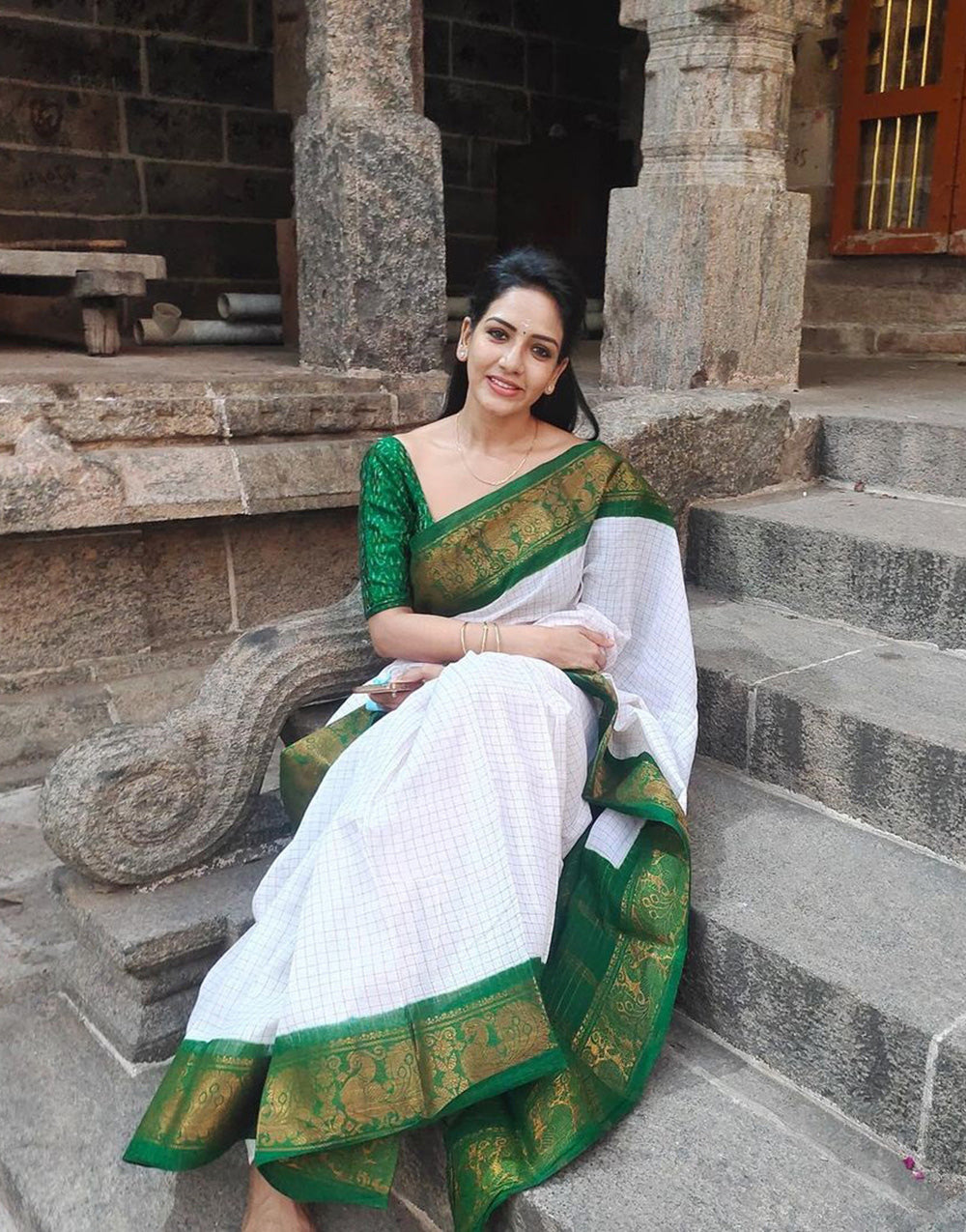 Off white saree shop with green border