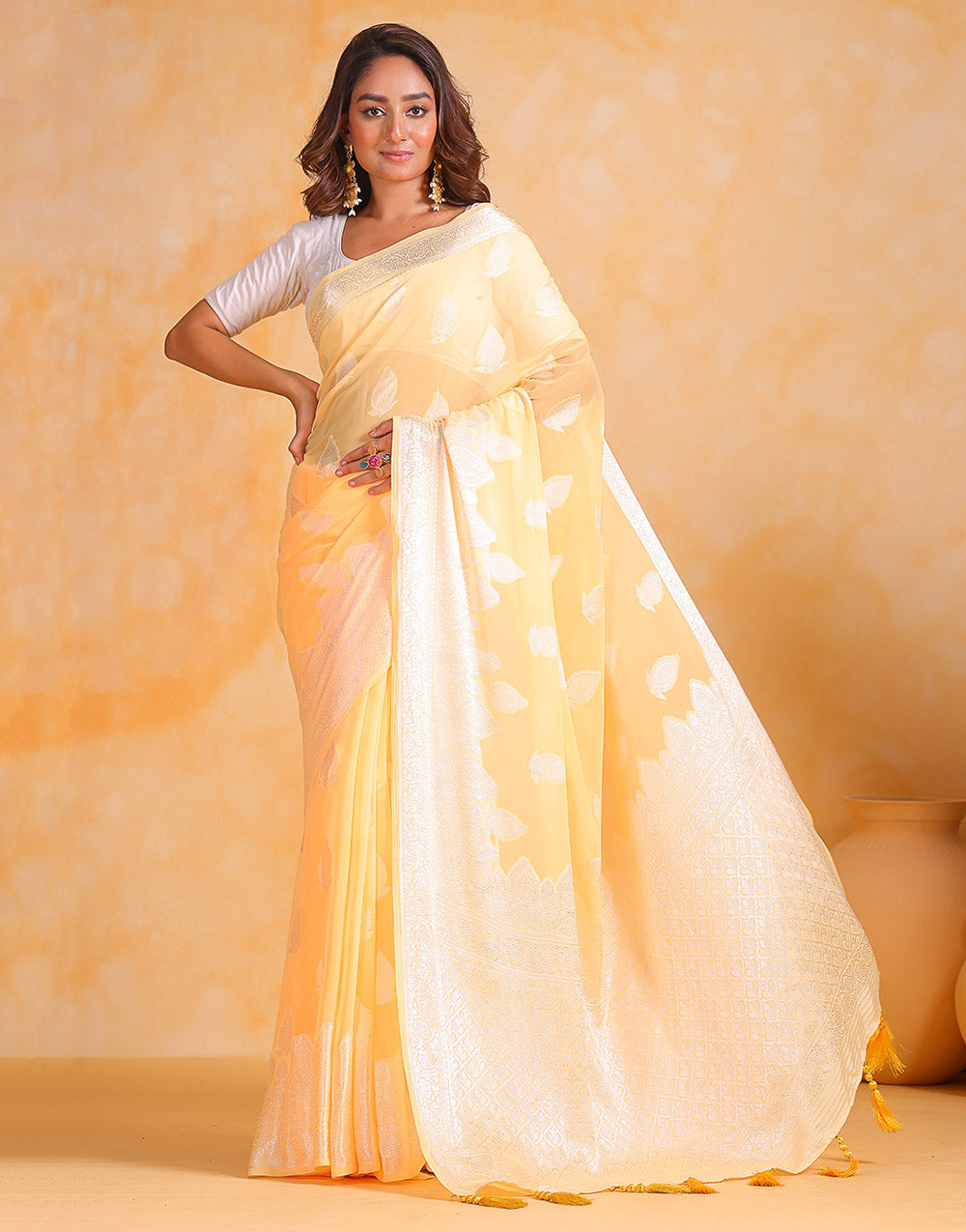 Pastel Yellow Georgette Saree With Silver Soft Weaving Work