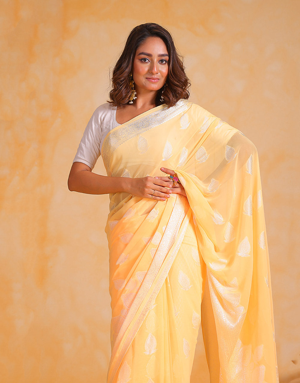 Pastel Yellow Georgette Saree With Silver Soft Weaving Work