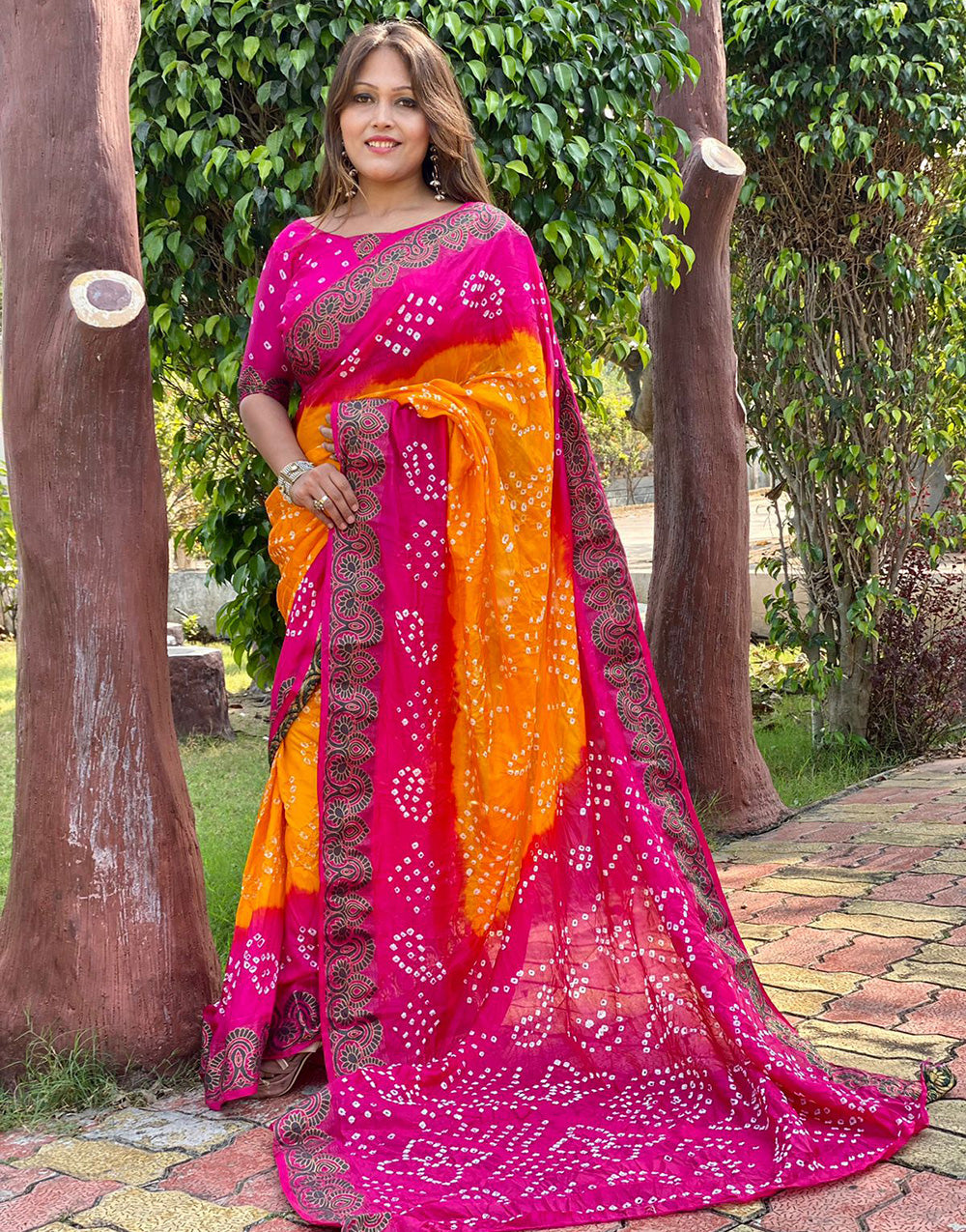 Pink And Yellow Bandhej Silk Saree With Zari Waving Work