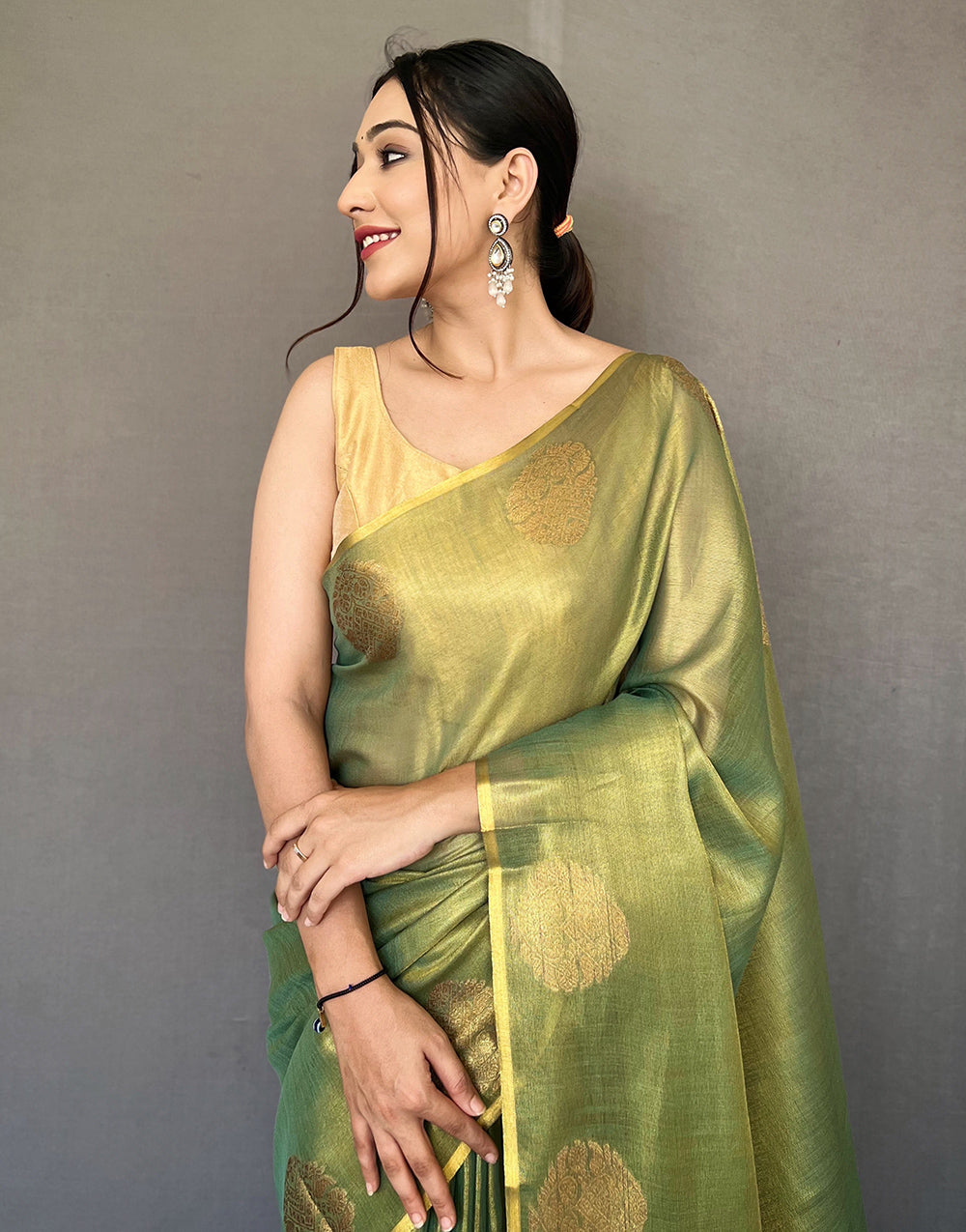 Dark Green Tissue Silk Saree With Zari Weaving Work