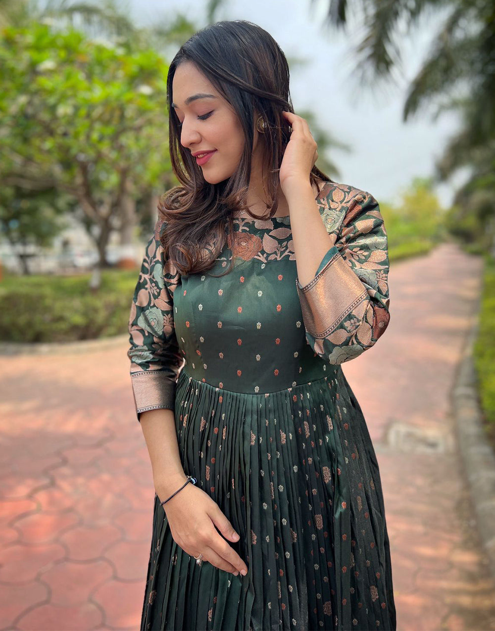 Dark Green Banarasi Silk Copper Zari Weaving Designer Gown