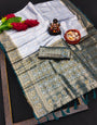 Pine Green Kanjivaram Silk Saree With Zari Weaving Work