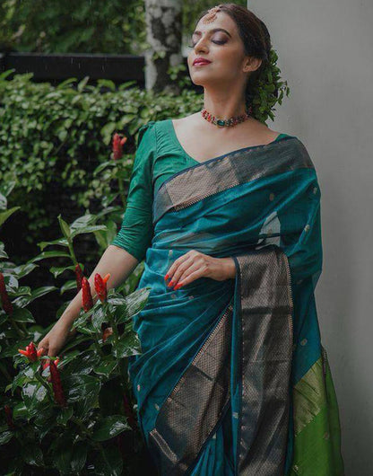 Teal Green Soft Linen Silk Saree With Zari Weaving Work